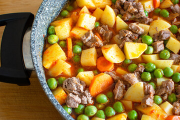 Boiled beef with vegetables is unique to Turkish cuisine. peas, potatoes, carrots and meat.