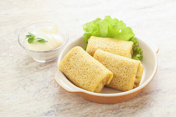 Stuffed pancakes with meat and cream