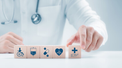 Doctor arranged wooden block with icons of medical, health check and healthcare, digital future...