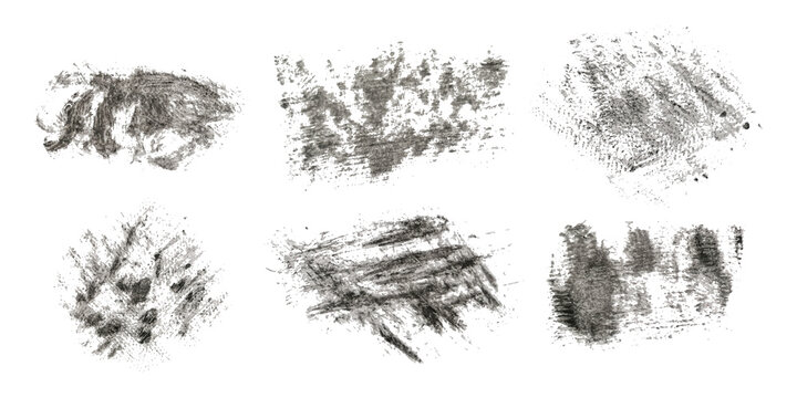 A set of graphic brushes. Dense grunge vector texture. Separate on a white background. Scratches, paint stains, smears. Ink. Vintage effect.