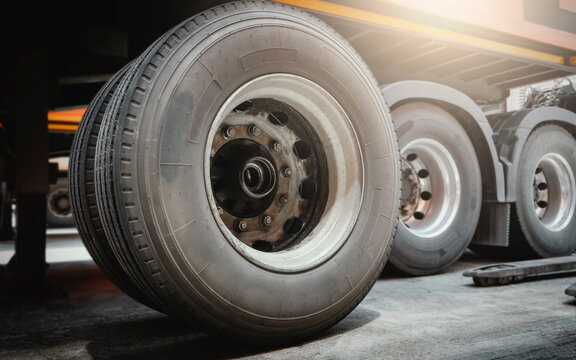 Truck Spare Wheels Tyre Waiting for to Change. Big Truck Wheels Tires. Freight Trucks Cargo Transport. Auto Repair Service Shop. 		