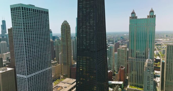 Skyscrapers of amazing Chicago. Drone shot rising along the outstanding city against blue sky backdrop.