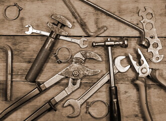 Building and measuring tools. Collection of old tools on a wooden background. The concept of repair and construction work. Old and rusty tools.