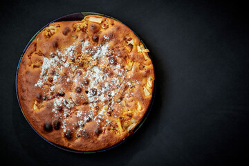 Homemade apple pie on a dark background