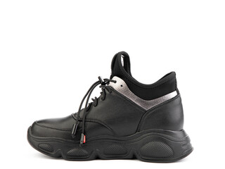 Silver and black leather sneakers. Casual women's style. Black rubber soles. Isolated close-up on white background. left side view. Fashion shoes.