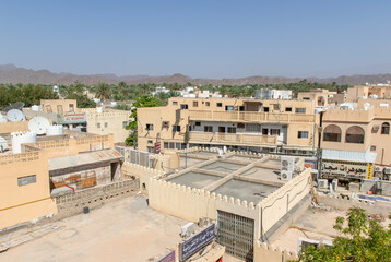 Naklejka premium Nizwa, Oman - famous for its fortress and part of an amazing oasis full of palms and bananas, Nizwa is one of the most scenographic villages in Oman 