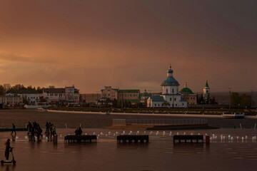 Fototapeta na wymiar the building of the Holy Trinity monastery at sunset on a rainy evening