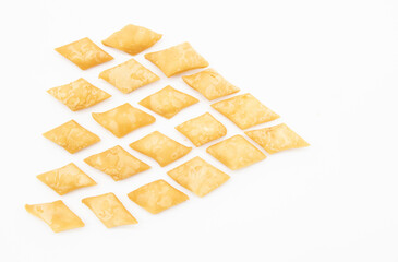 selective focus, rectangular shape salty biscuits isolate on white, top view