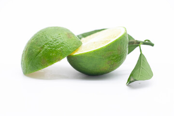 half slice mandarines or Tangerine green isolate on a white background