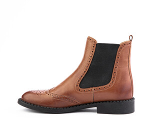 Women's autumn chelses brown leather boots isolated white background. Left side view. Fashion shoes. Photoshoot for shoe shop concept.