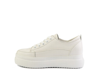 White classic leather trainers. Casual women's style. White lacing and white rubber soles. Isolated close-up on white background.