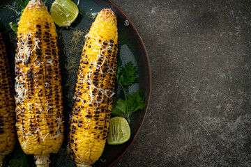barbecue and grilled corn with cheese and lime - Powered by Adobe