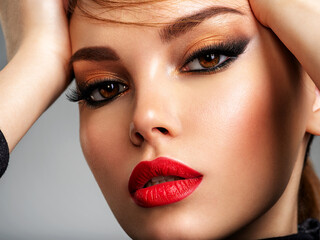 Beautiful girl with red lips and short hair. Pretty face of an young sensual woman. Closeup...