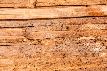 Fototapeta na wymiar Warehouse wood closeup. At the sawmill plant wooden blanks for furniture and construction.