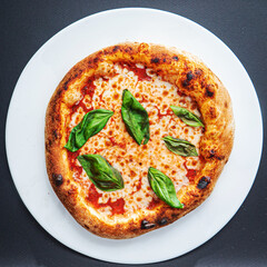 pizza on the black background, top view