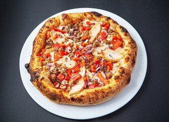 pizza on the black background, top view