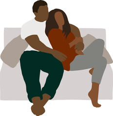 Husband and wife sit hugging on the couch with pillows