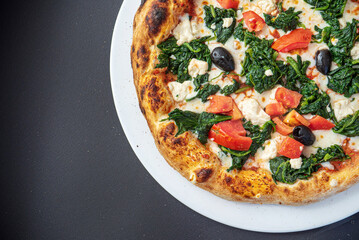 pizza on the black background, top view