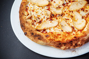 pizza on the black background, top view