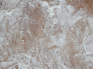 Old wooden board with flour. Background. Photo. Flour over wood
