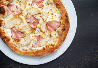 pizza on the black background, top view