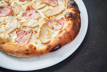 pizza on the black background, top view