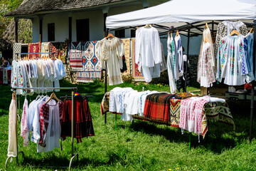Traditional Romanian hand made clothes displayed for sale at a hand made festival in Bucharest, Romania.