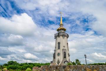Christian church cross in high steeple tower for prayer