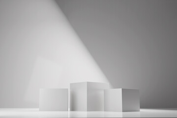 Three white square stands on white background.