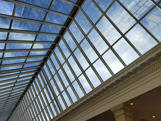 Skylight or glass sunroof ceiling of a building. glass ceiling with window. The shopping center, business center. Modern design architecture, or energy conservation model using nature sunlight concept