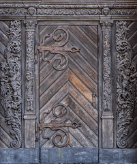 Ancient wooden carved door of a gothic church