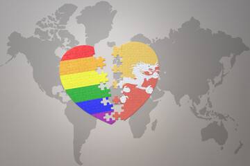 puzzle heart with the rainbow gay flag and bhutan on a world map background. Concept.