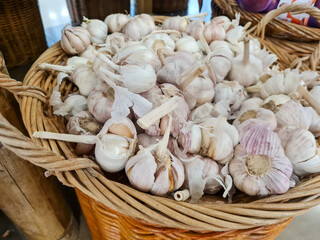 Garlic Cloves and Bulb in vintage wooden bowl.