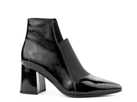 Women's autumn ankle black leather boots with black zip and average heels, isolated white background. Right side view. Fashion shoes.