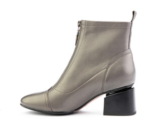 Women's autumn ankle grey leather boots with zip and average heels, isolated white background. Left side view. Fashion shoes.