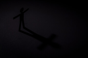 dark human figure in darkness