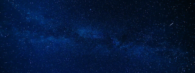 Panorama of the night starry sky on the background of the Milky Way with many colorful shining stars - Powered by Adobe