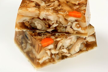jellied meat pieces on white background. Jelly with meat, pork aspic, traditional russian dish. meat aspic on white