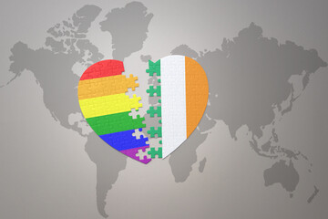 puzzle heart with the rainbow gay flag and ireland on a world map background. Concept.