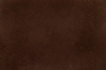 Brown background from decorative plaster with abstract spots. Unusual beige wall texture with beautiful patterns, creative surface background. Front covering for facing of buildings.