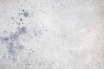 Light background of decorative plaster with abstract spots. Unusual texture of white or gray wall with beautiful patterns, creative surface background. Finishing coating for building cladding.