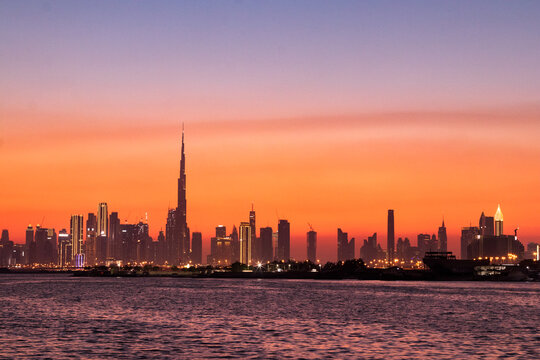 Dubai Creek Harbor sunset with the image of Dubai Downtown, October 2021