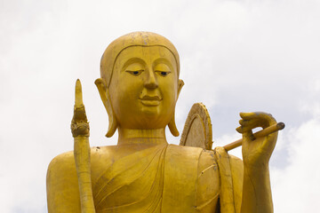 Big Golden statue of a buddhist monk