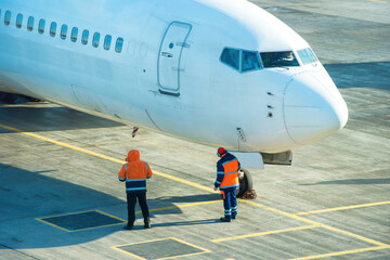 Airport service stuff near plane