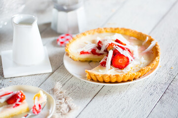 Appetizing strawberry pie served in the morning for breakfast covered with white chocolate. Beautiful light still life with place for text. beautiful food