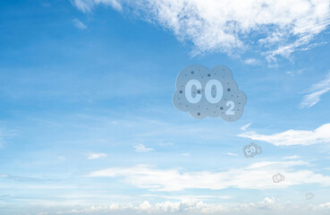 CO2 symbol on blue sky and white clouds. CO2 emissions. Greenhouse gas. Carbon dioxide gas global...