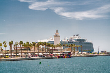 Panoramic view of the port of Malaga. In background Wonder of the Seas docked, the largest cruise...