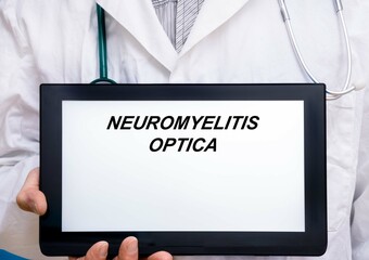 Neuromyelitis Optica.  Doctor with rare or orphan disease text on tablet screen Neuromyelitis Optica