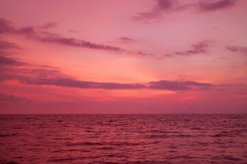 Fototapeta na wymiar Fantastic Gradient Pink and Purple Seascape at Tropical Sunset
