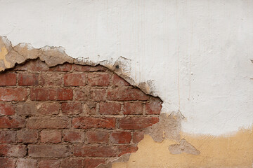 Old brick wall background with white paint.